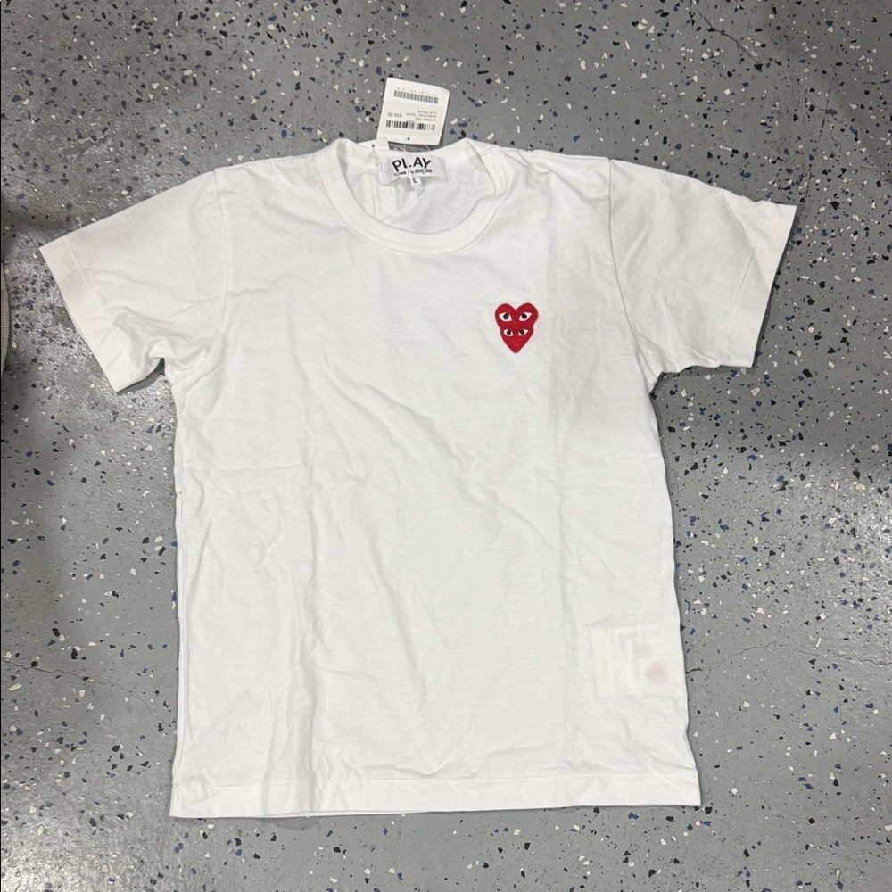 Comme des Garcons Kids White Shirt with Red Heart pit to pit measures 19 in